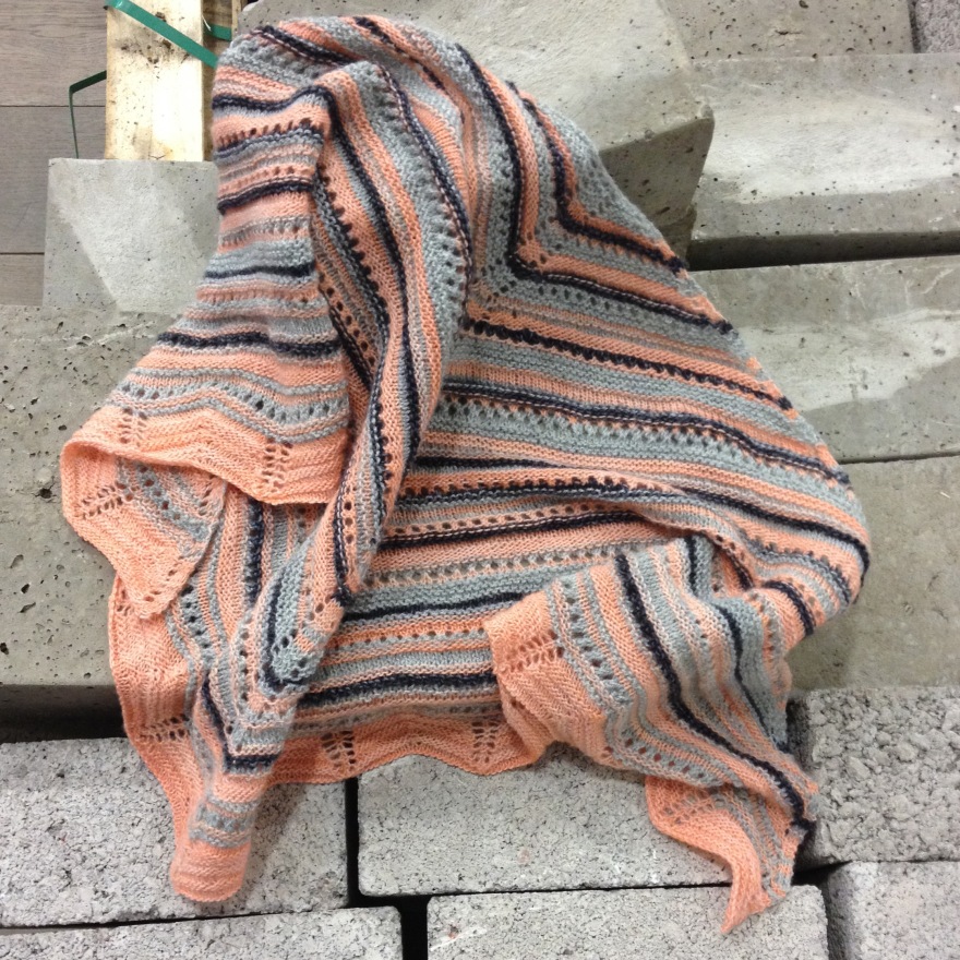 apricot knitted scarf on bricks